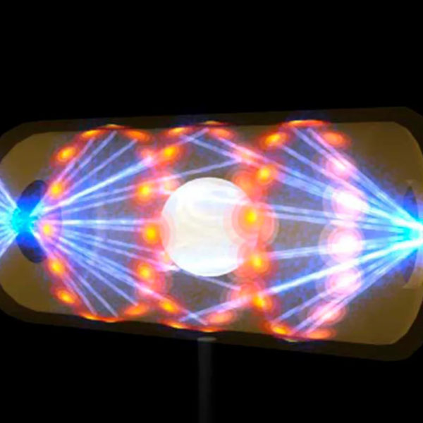 这张由劳伦斯利弗莫尔国家实验室的国家点火设施提供的插图描绘了一个空腔胶囊内的目标颗粒，激光束从两端的开口进入。光束将目标压缩并加热到发生核聚变的必要条件。